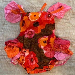 Romper with ruffle butt. Pink, orange and brown floral. 6-12 month.